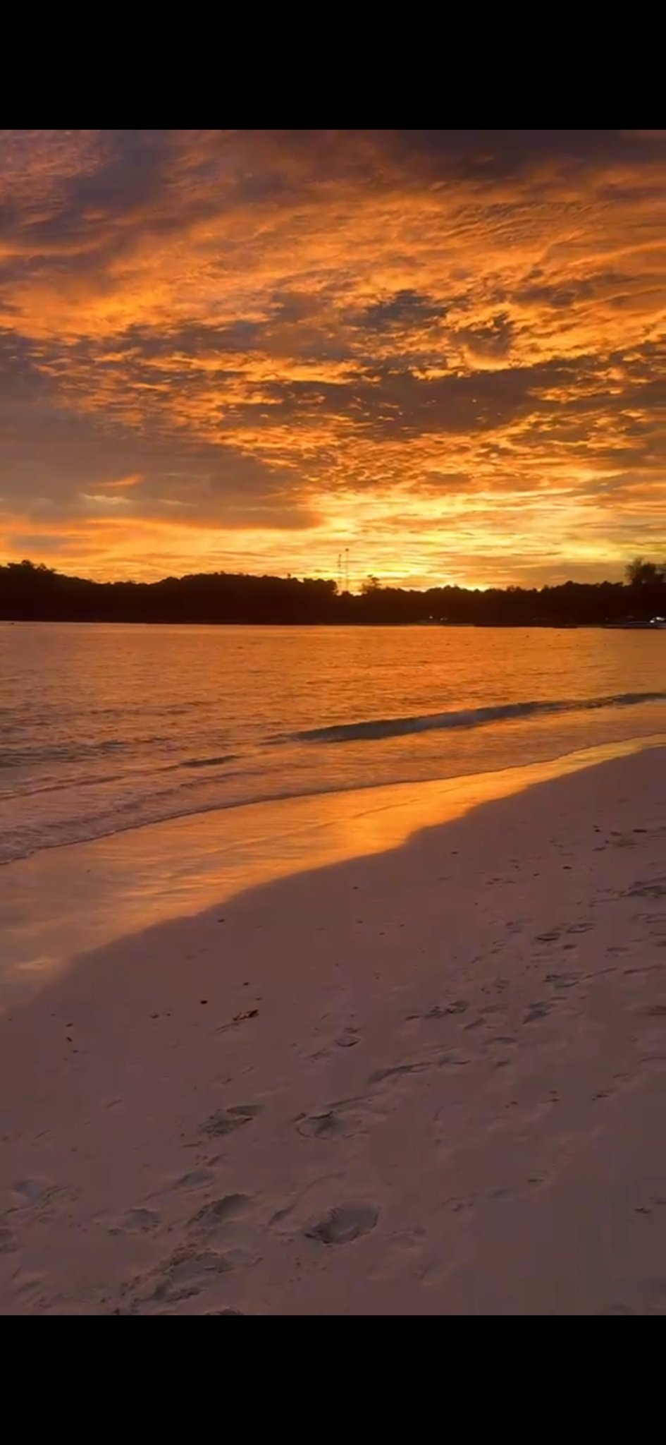Sunset glowing orange over the beach at Koh Lipe, Thailand