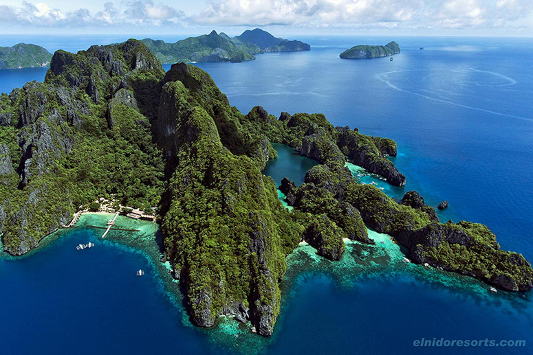 Aerial view of limestone islands and blue lagoons near El Nido, Palawan